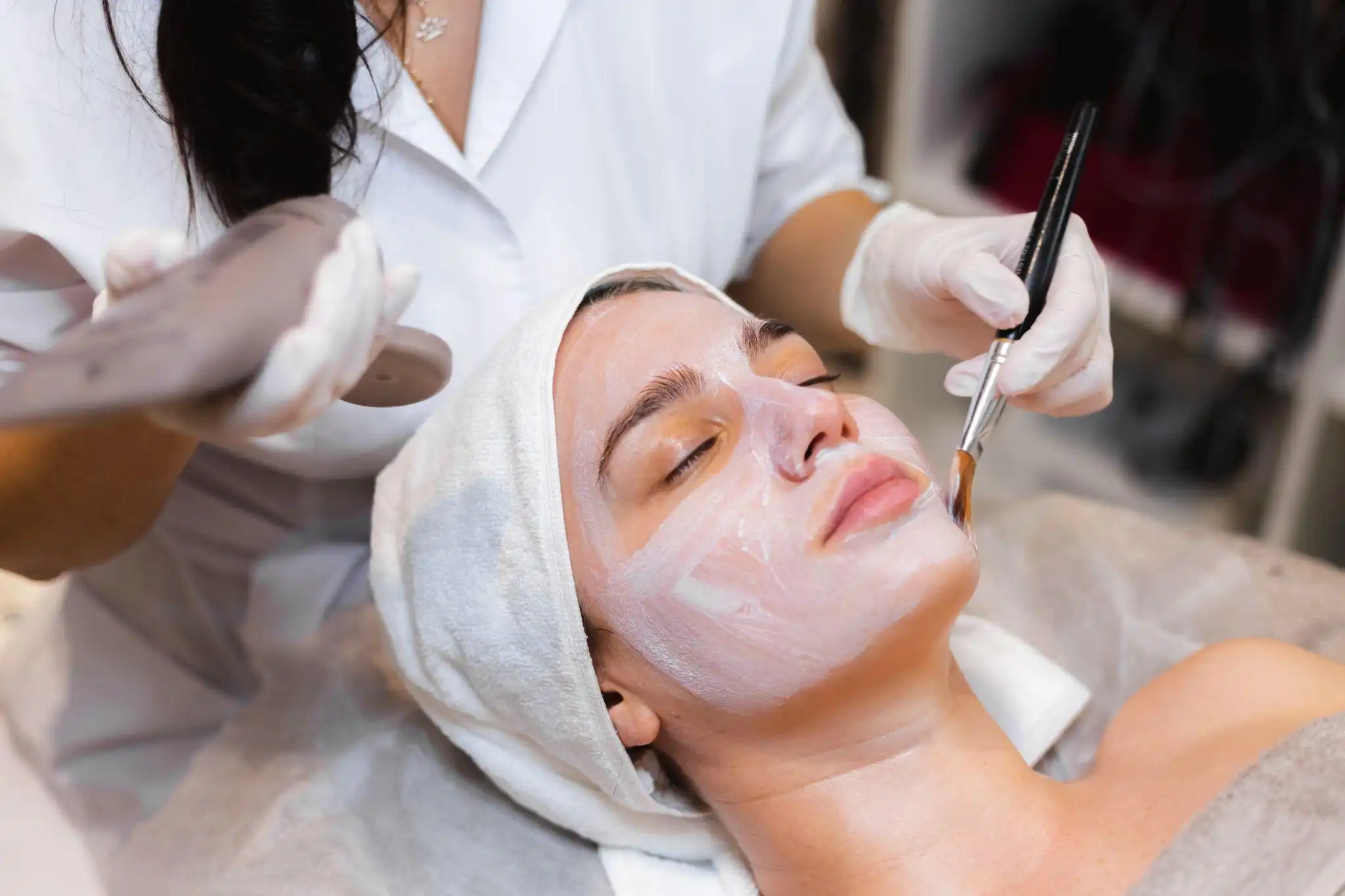 Facial treatment in Ubud with professional spa therapist applying rejuvenating mask for radiant skin.