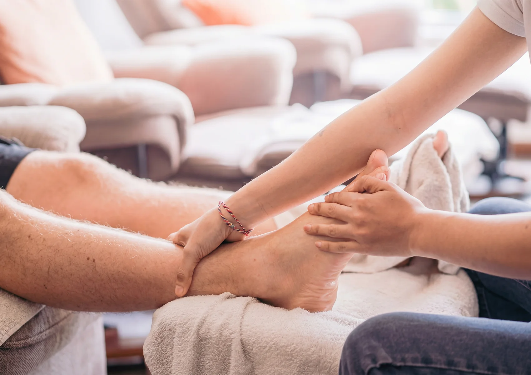 Professional foot reflexology treatment in Ubud with targeted pressure point massage to relieve fatigue, improve circulation, and promote deep relaxation in a calming Bali spa setting